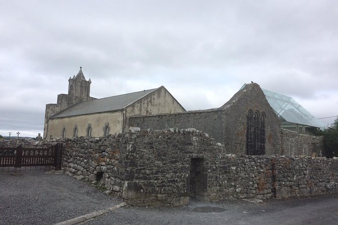 Burren Guided Electric Bike tour with Poulnabrone Portal Tomb - Stop 2: Noughaval Church, graveyard, and market stone