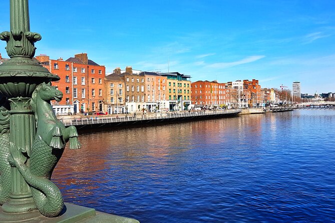 Private Dublin Sights and Pints (Walking Tour) - Ha’penny Bridge photo moment and river views toward Guinness and the Docklands