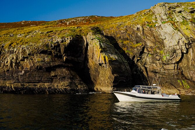 The Valentia Island Experience - Beginish Island coastline plus the Valentia Lighthouse at the sea’s edge